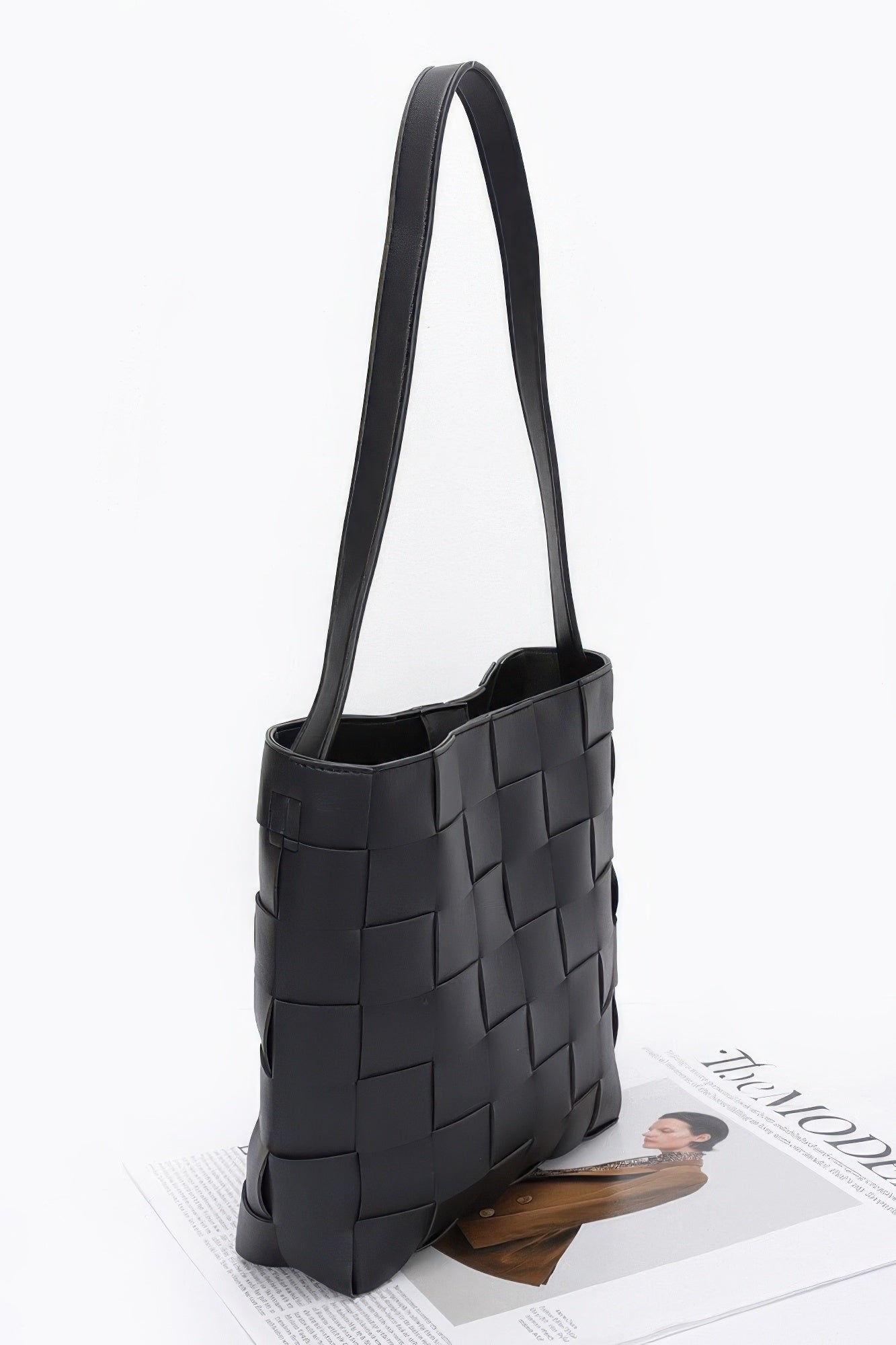 Black woven tote bag with long handles, stylish everyday accessory for women's fashion