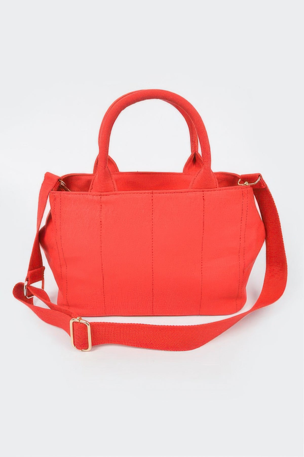 Vibrant red structured handbag with top handles and adjustable shoulder strap, perfect for everyday style.