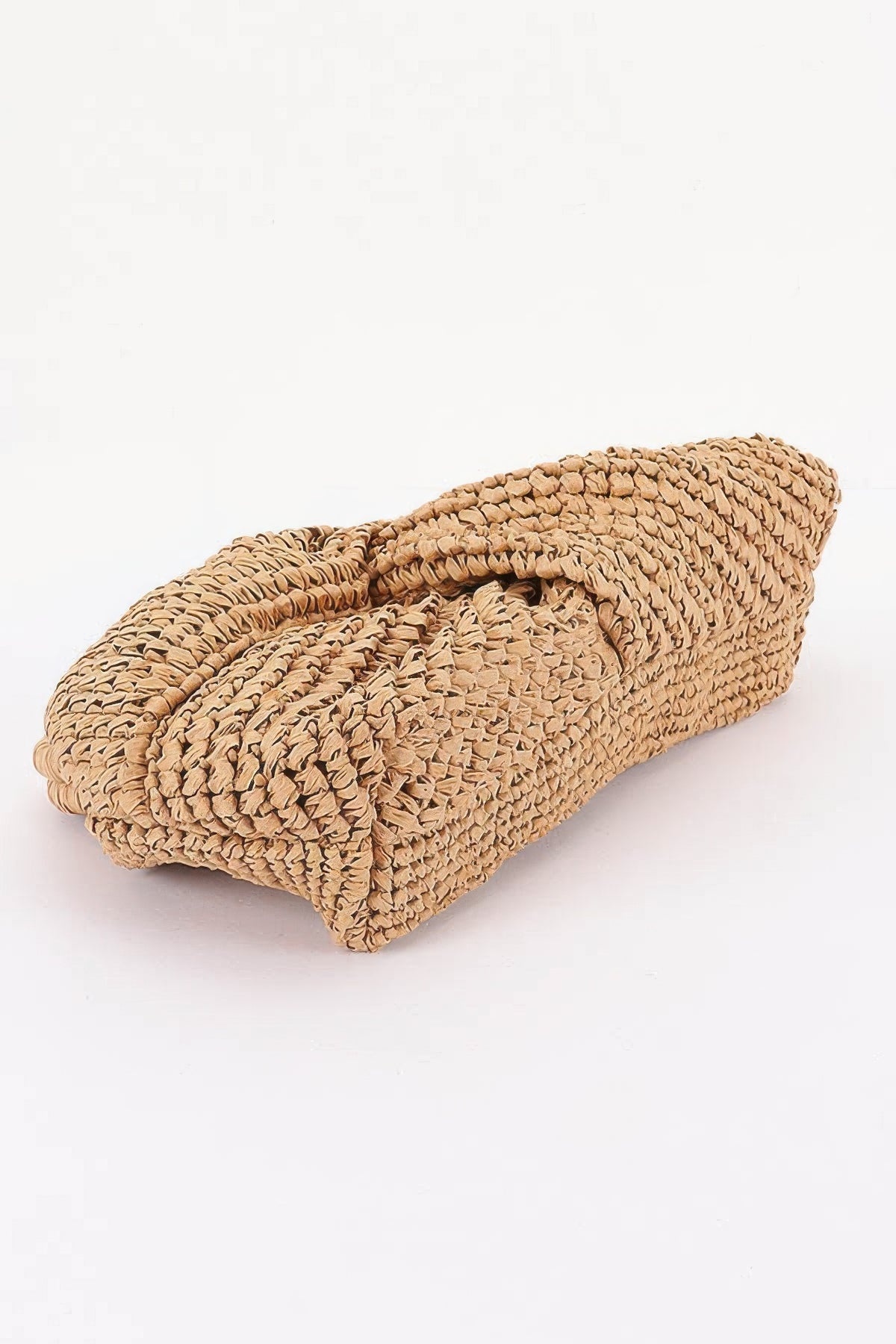Woven straw clutch bag with textured ruched design, perfect for summer outfits and beach style.