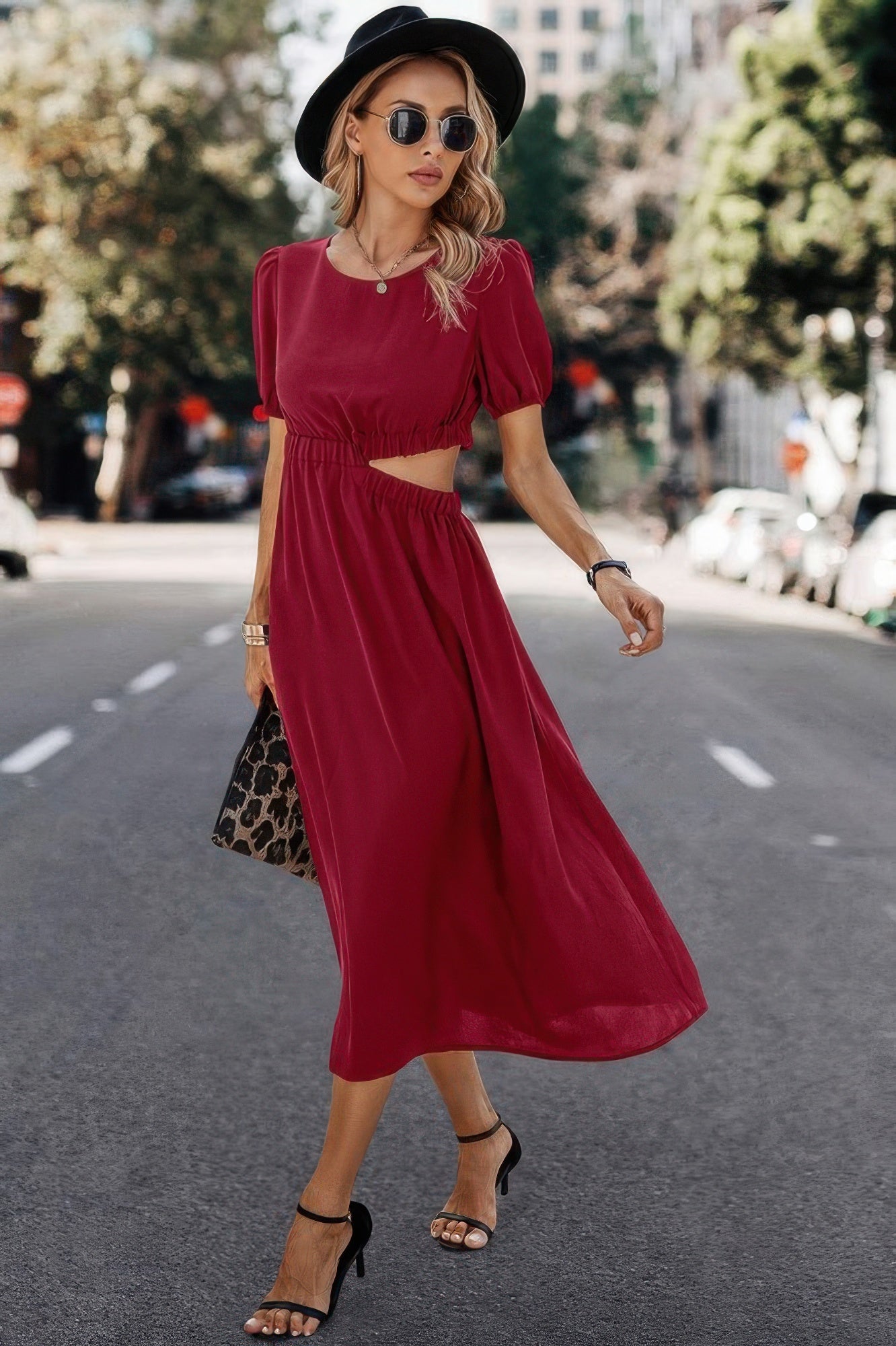 Woman in stylish red midi dress with puff sleeves, black hat, and heels for chic everyday fashion