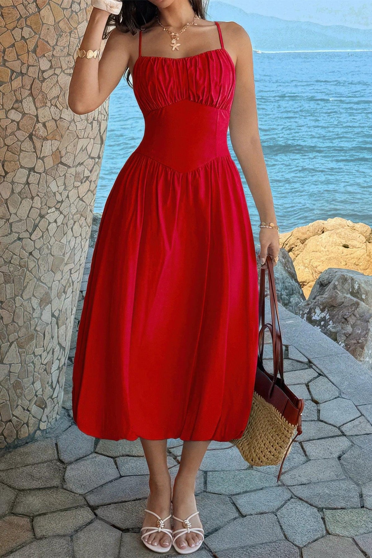 Red midi dress with ruched bodice, perfect for beachside elegance and summer style