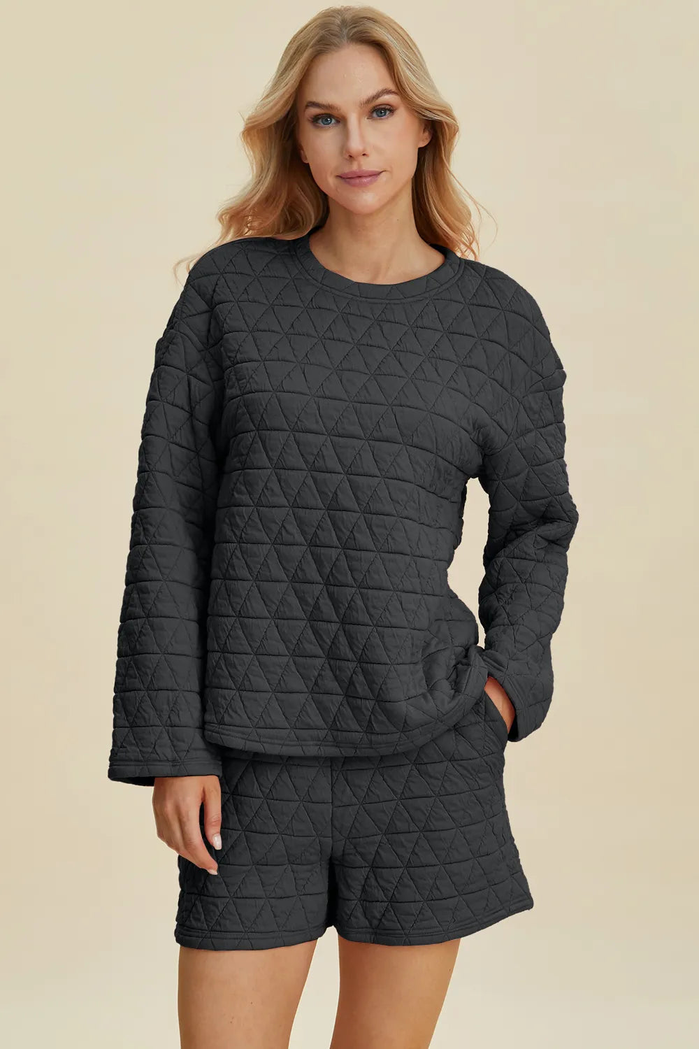 Black quilted pajama set with long sleeves and shorts, cozy women's loungewear